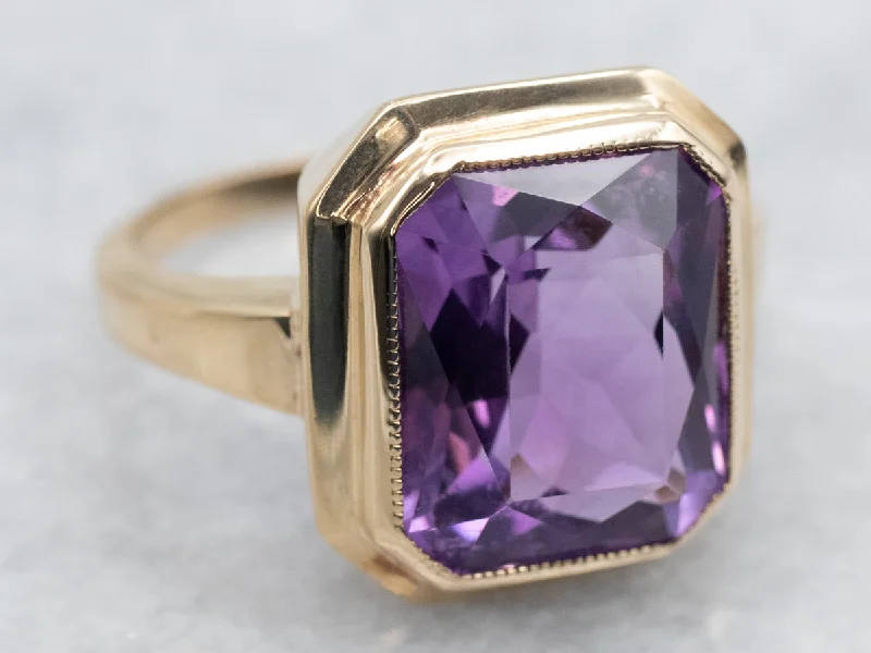 Yellow Gold Bezel Set Emerald Cut Amethyst Solitaire Ring