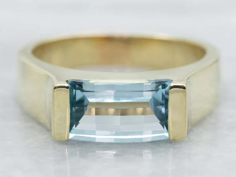 Yellow Gold East to West Emerald Cut Blue Topaz Ring